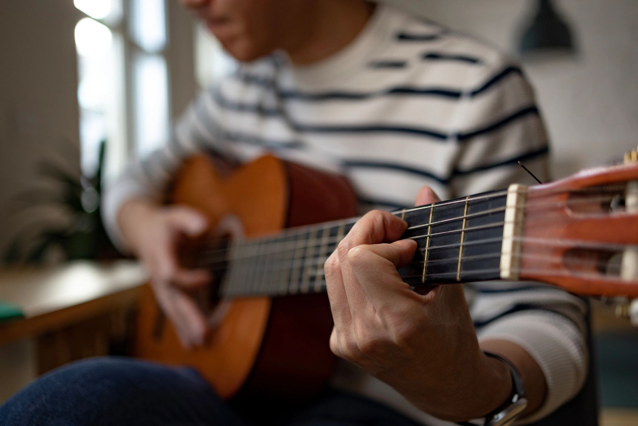 Close-up of acoustic guitar performance