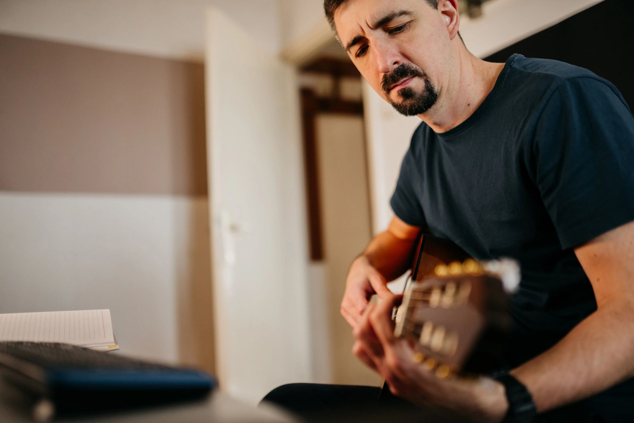 Artist recording while playing guitar